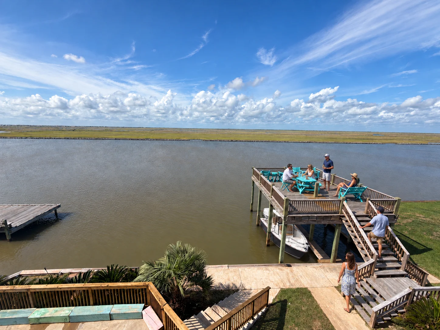 Illustrative guest gathering on the observation deck with the Sea Hunt in the boat slip